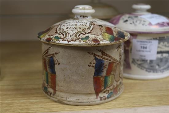 A Sunderland pink lustre jar and cover and two other jars and covers